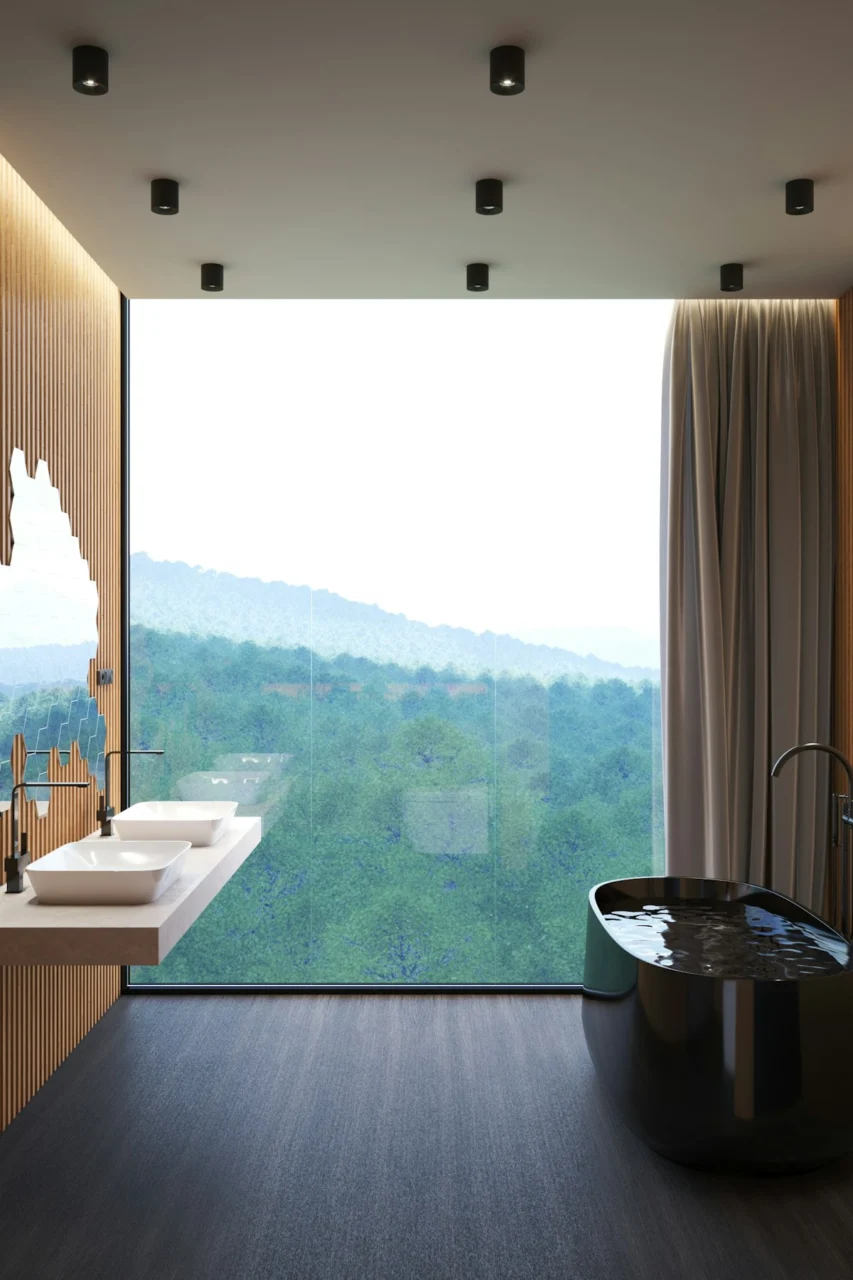 a bathroom with a large window and a large tub