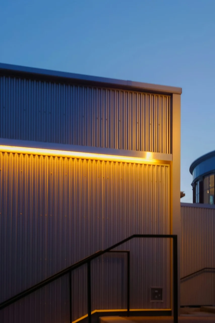 a building that has a light on the side of it