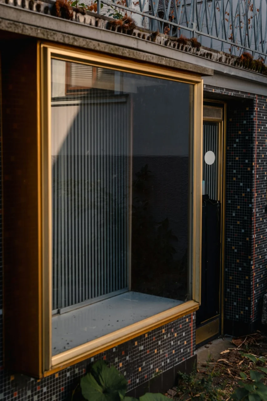 a building with a glass door and a balcony