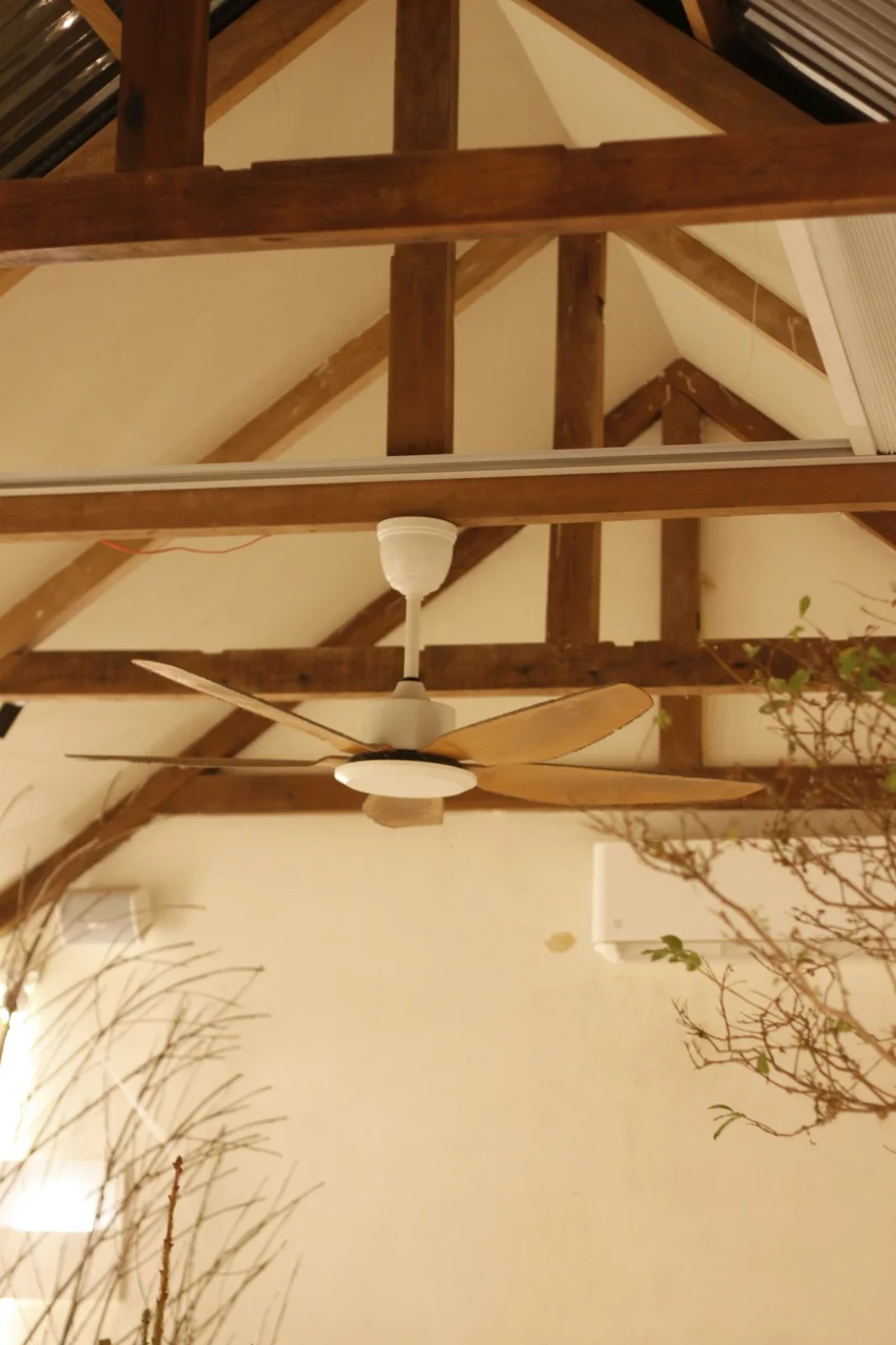 a ceiling fan mounted to the ceiling of a room