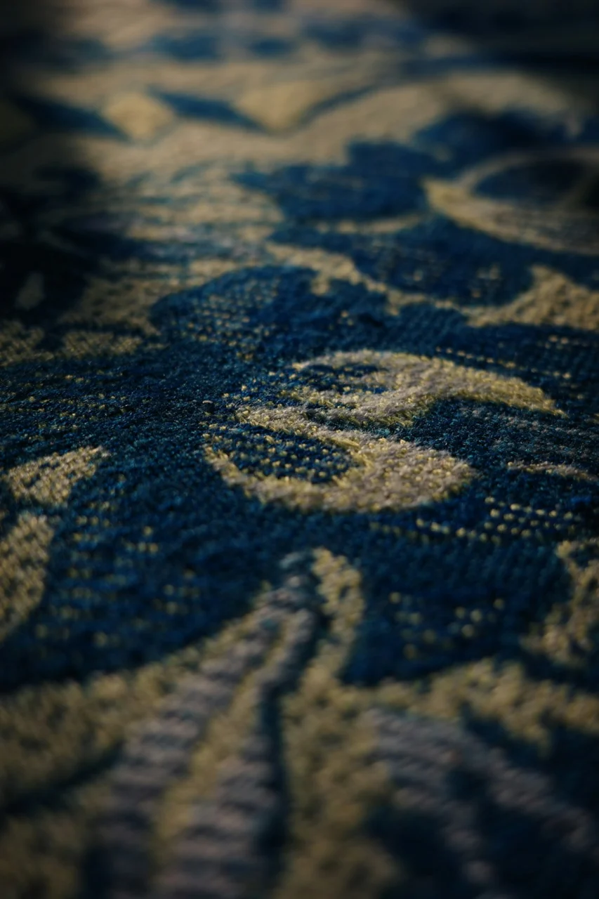 A close up of a blue and yellow carpet