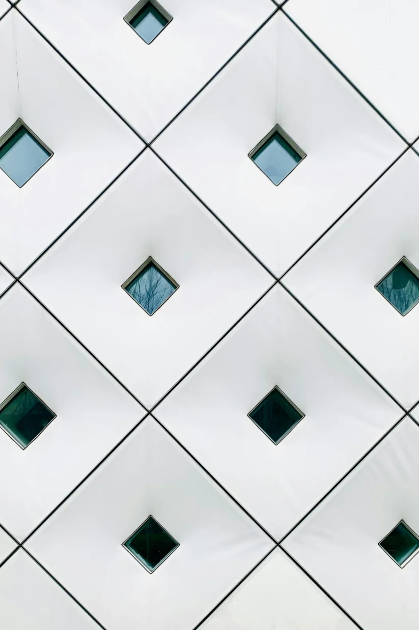 a close up of a building with many square windows