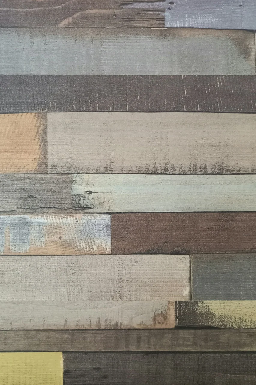 a close up of a wooden wall with different colors
