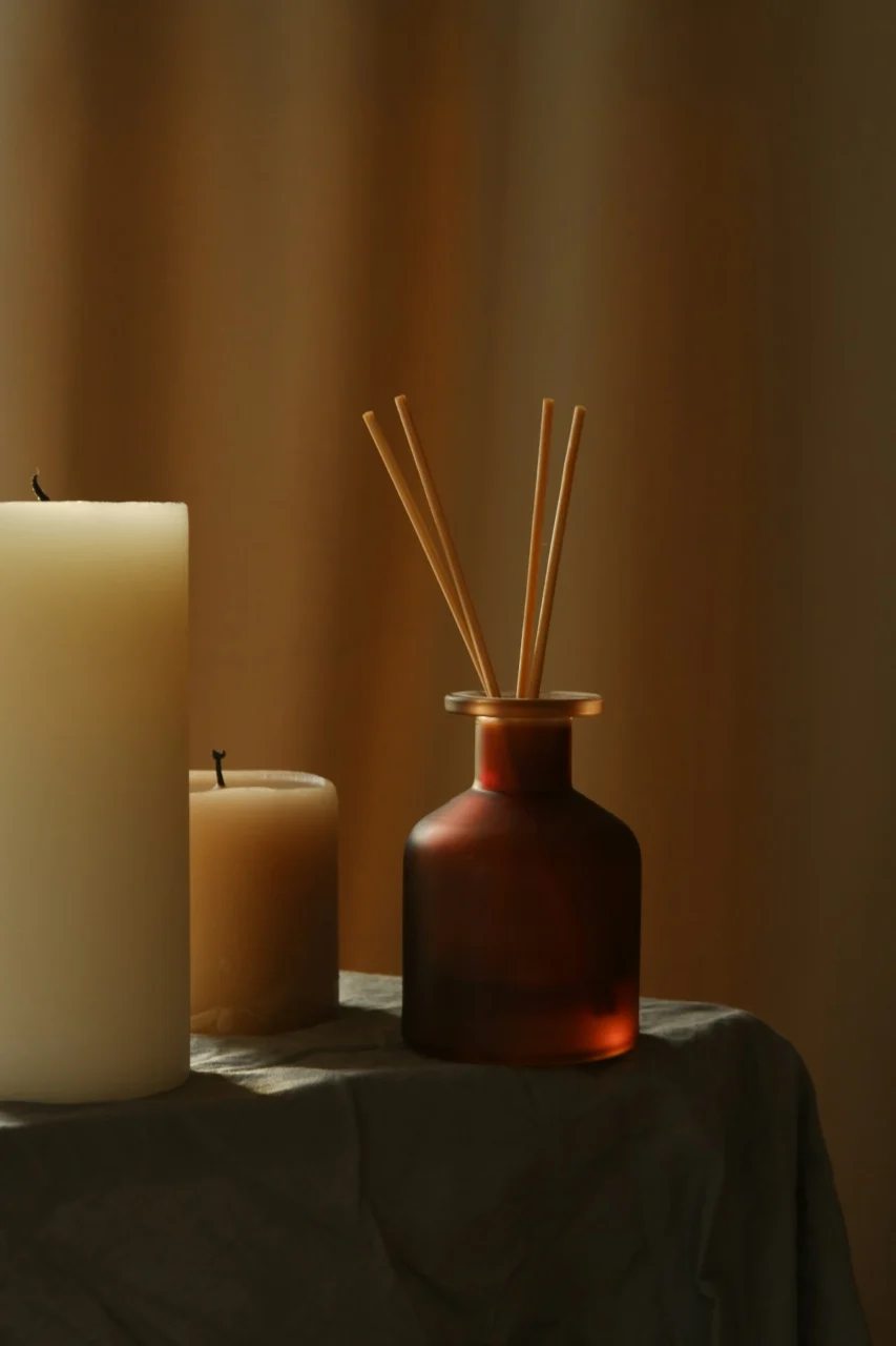 a couple of candles sitting on top of a table