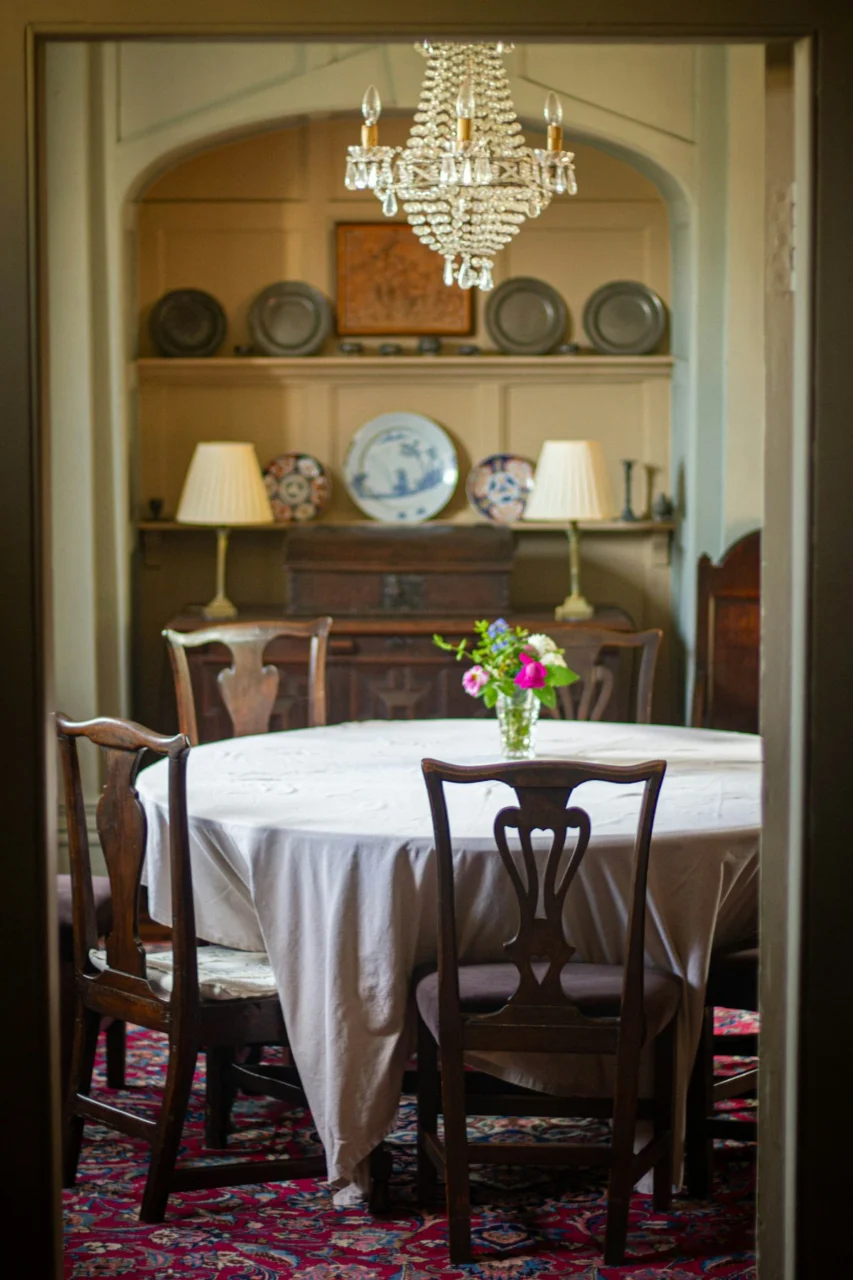 A dining room is set for a meal