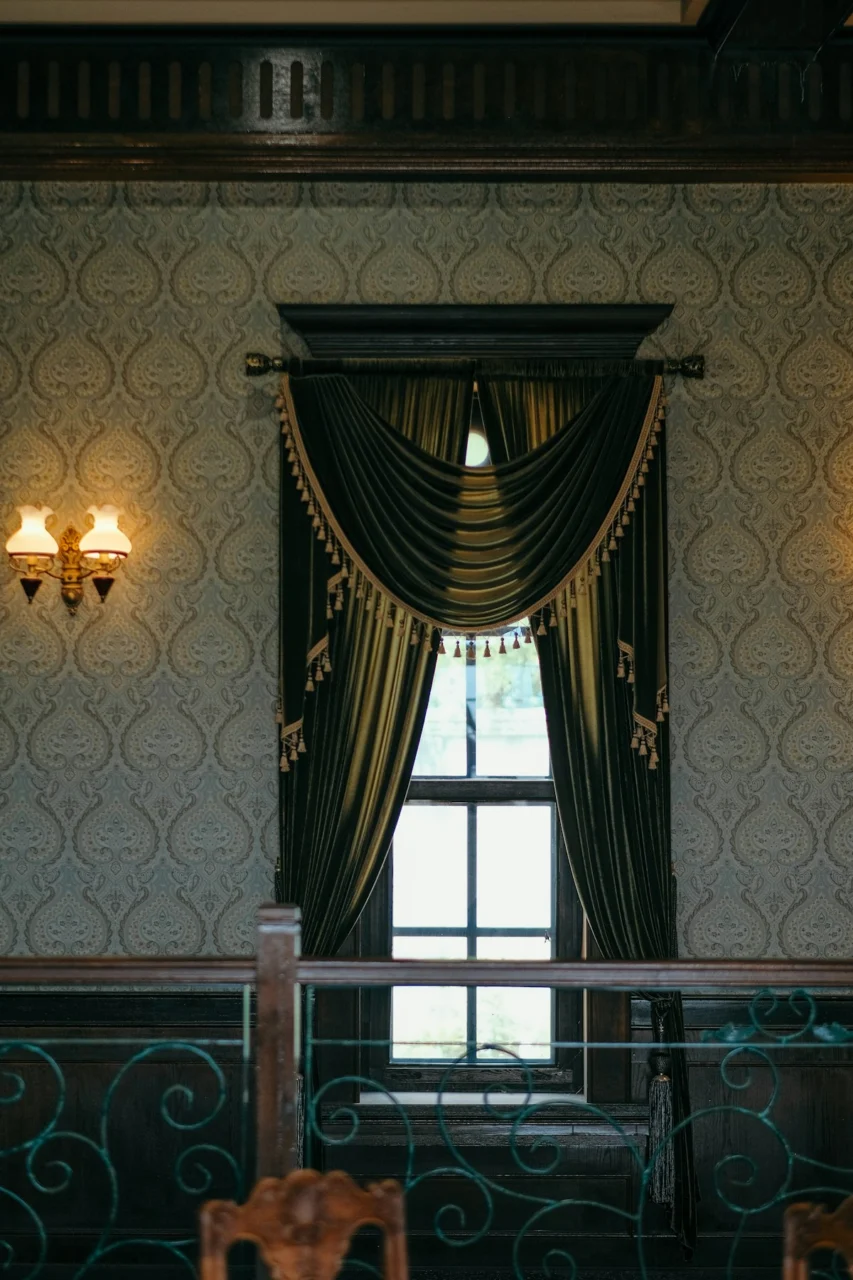 A dining room with a table and chairs