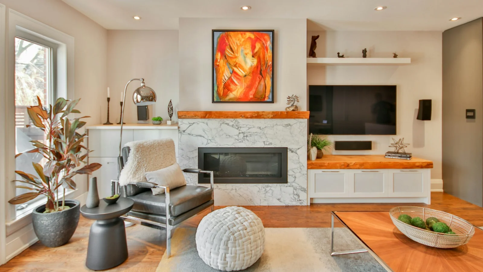 a living room filled with furniture and a fire place