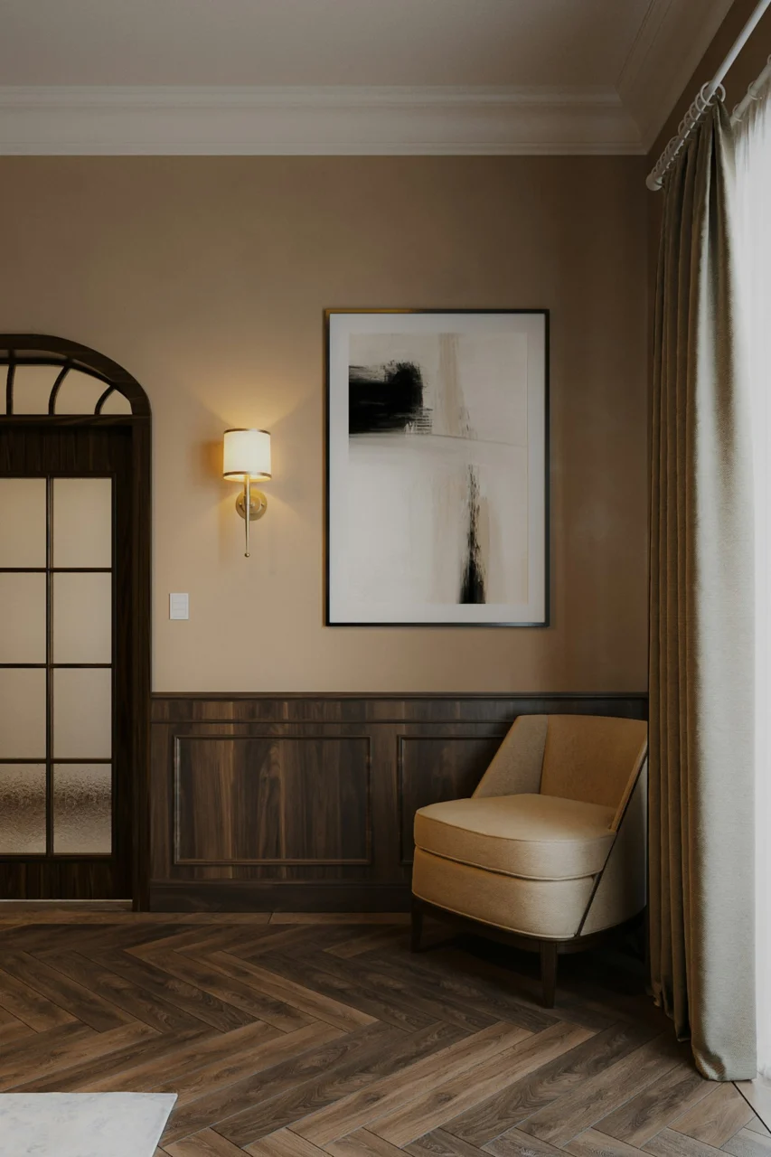 a living room with a chair and a picture on the wall