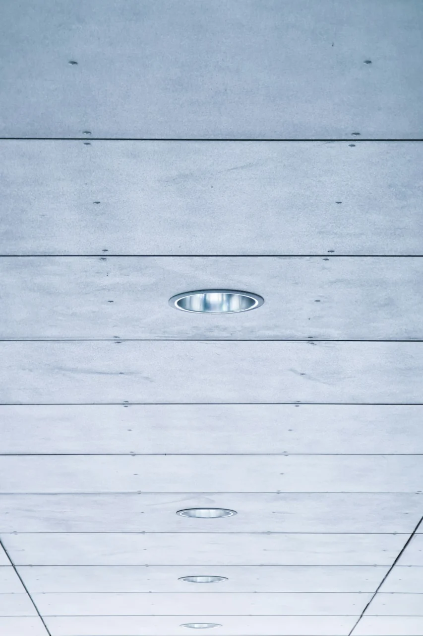 a long hallway with a ceiling made of wood planks