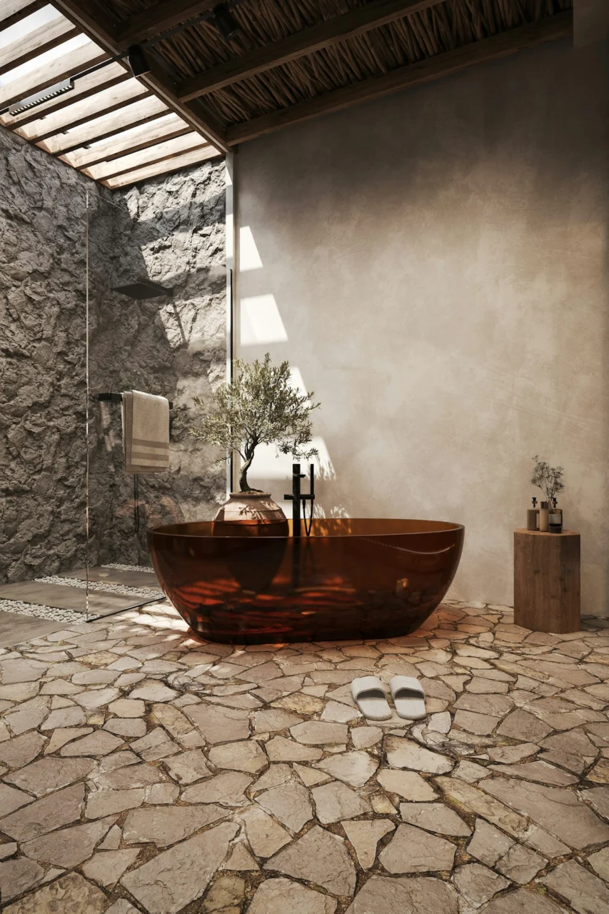 A luxurious bathroom with a copper bathtub and stone architecture