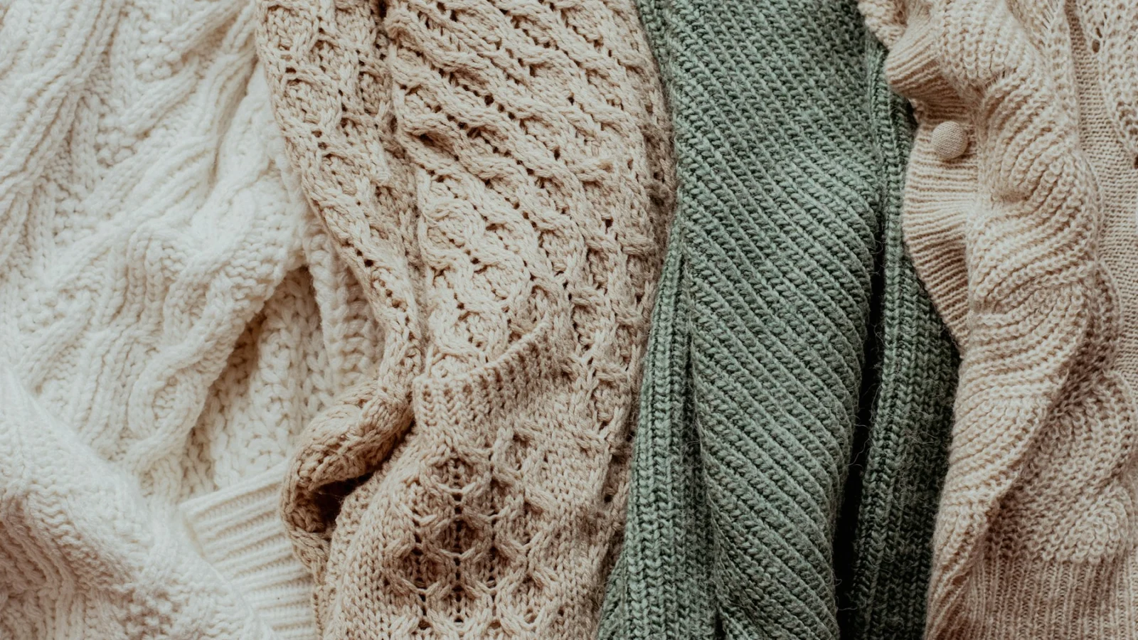 a pile of sweaters sitting next to each other