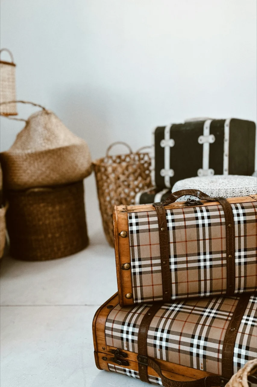 a stack of luggage sitting on top of a white floor