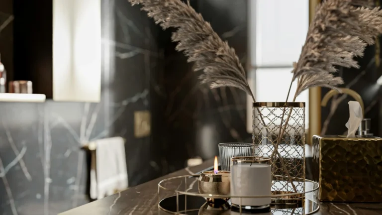 a table topped with a candle and a vase filled with flowers
