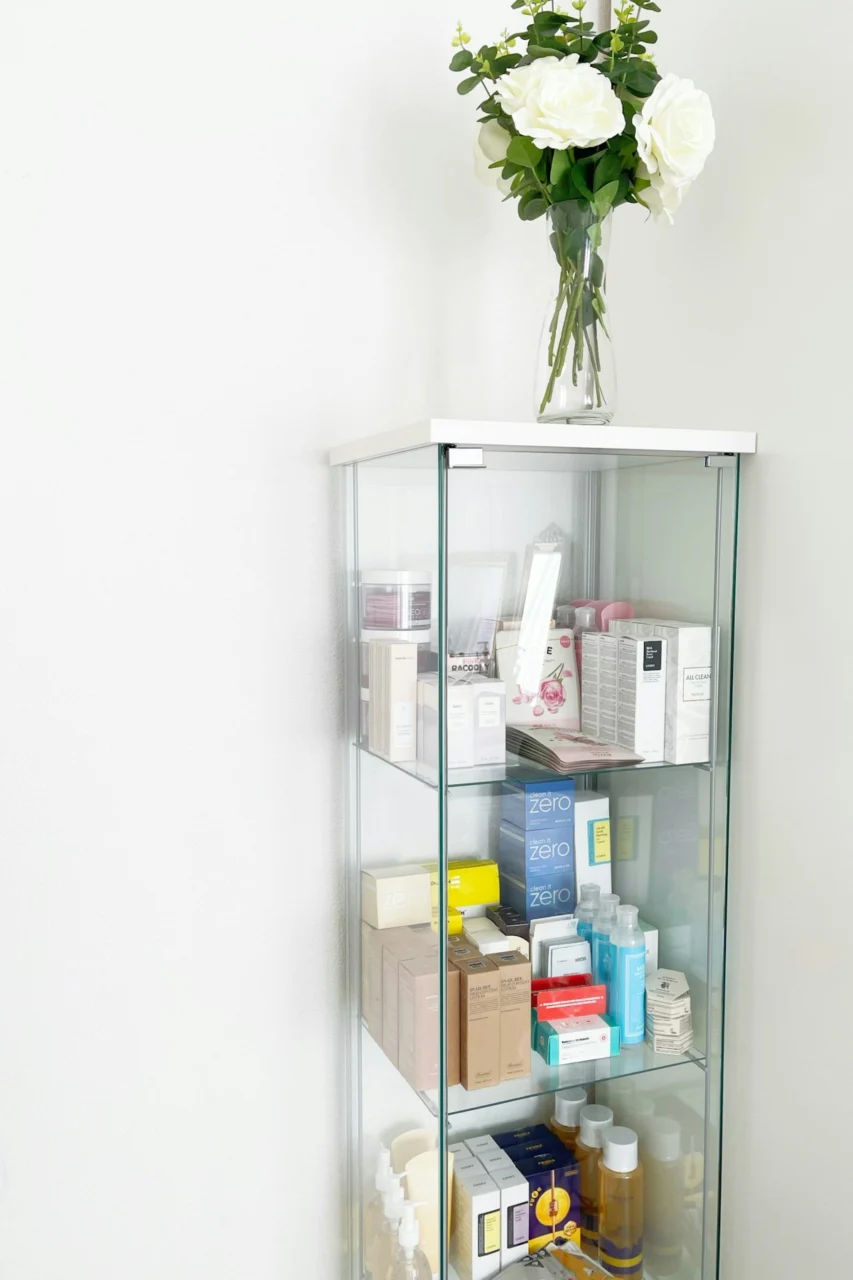 a vase of flowers on a shelf