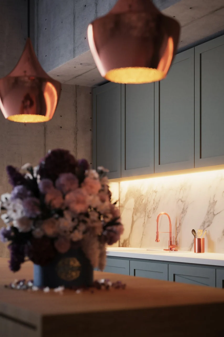 a vase of flowers sitting on a kitchen counter