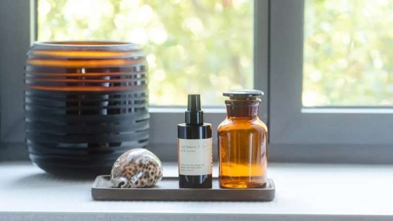 a window with a bowl of food and a bottle of liquid