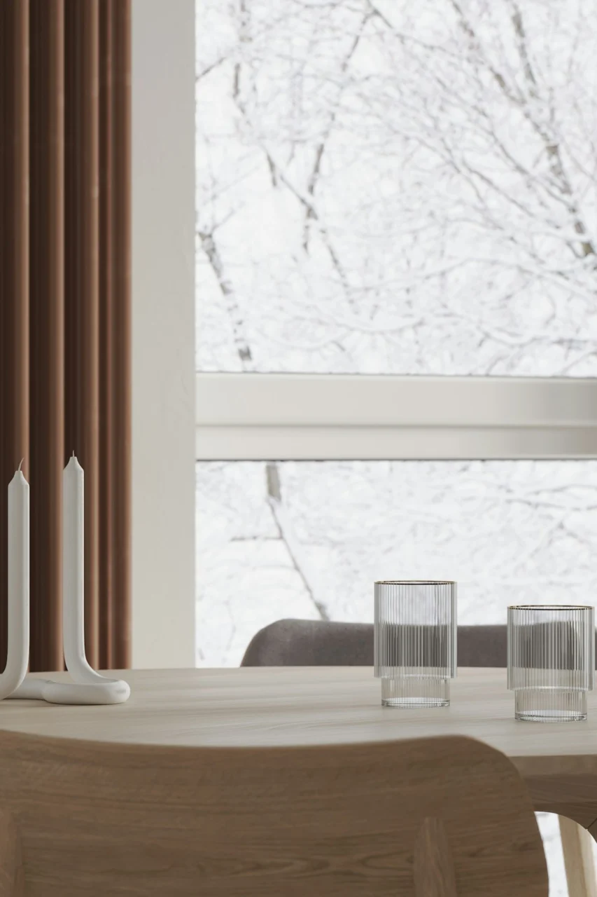 a wooden table with two candles on top of it