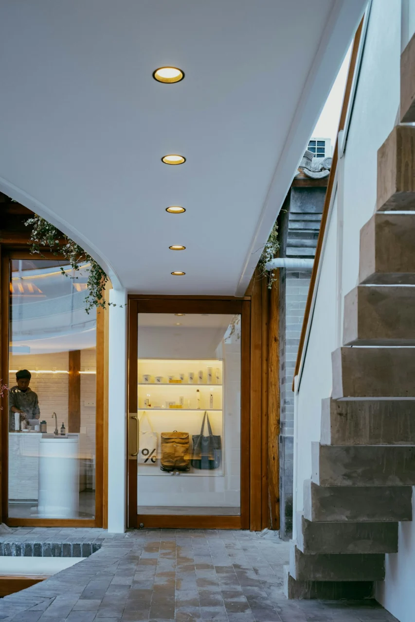 An open air cafe with a wooden staircase