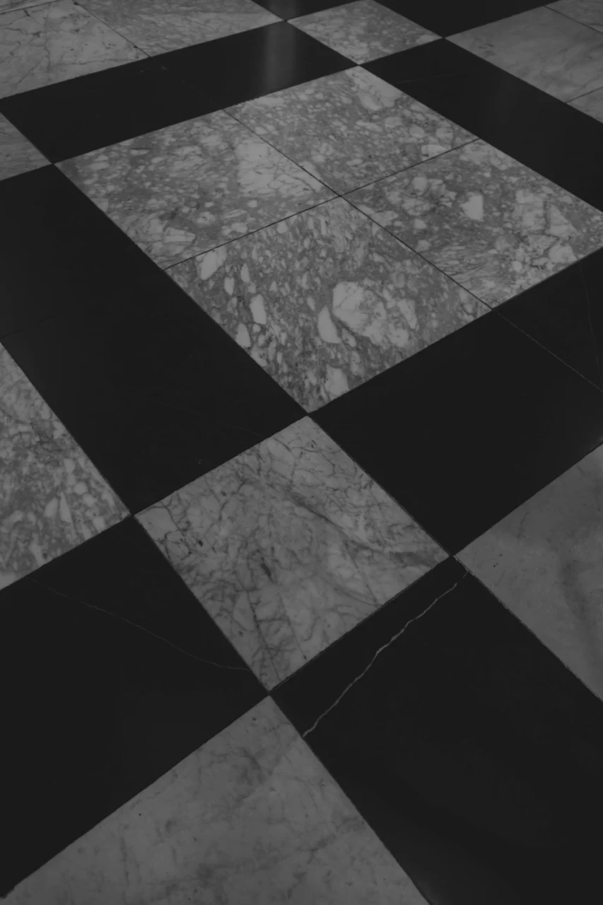 Black and white marble checkered floor tiles