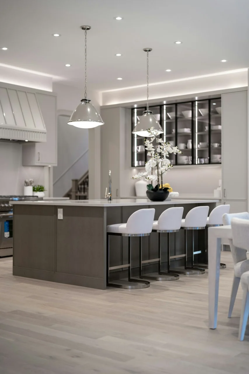 Bright, modern kitchen with a central island and white seating