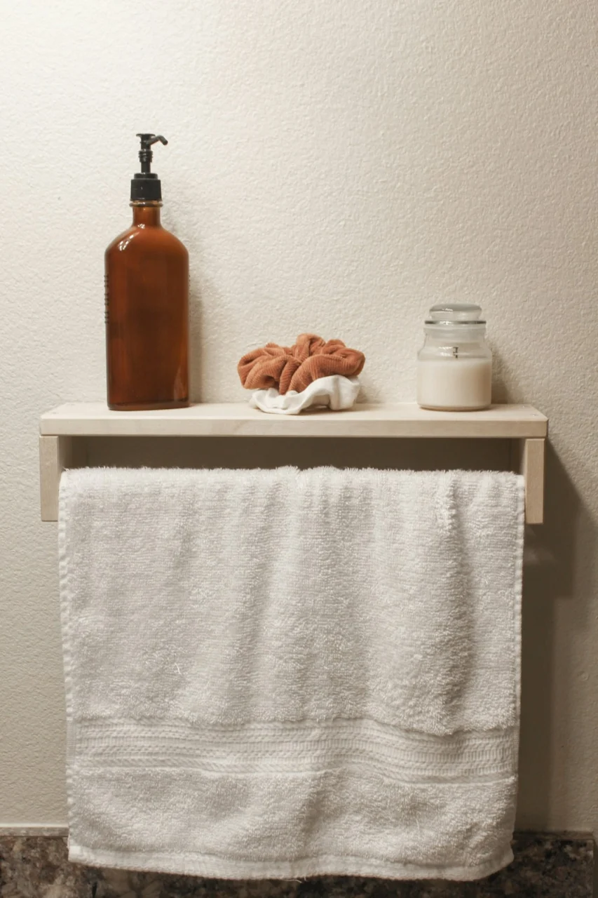 brown bottle on white towel