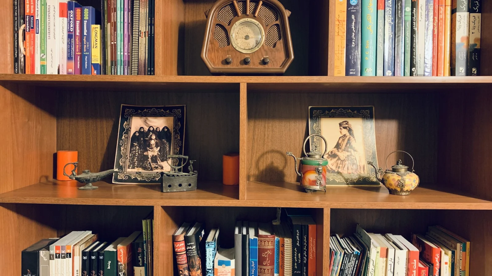 brown wooden bookshelf with books