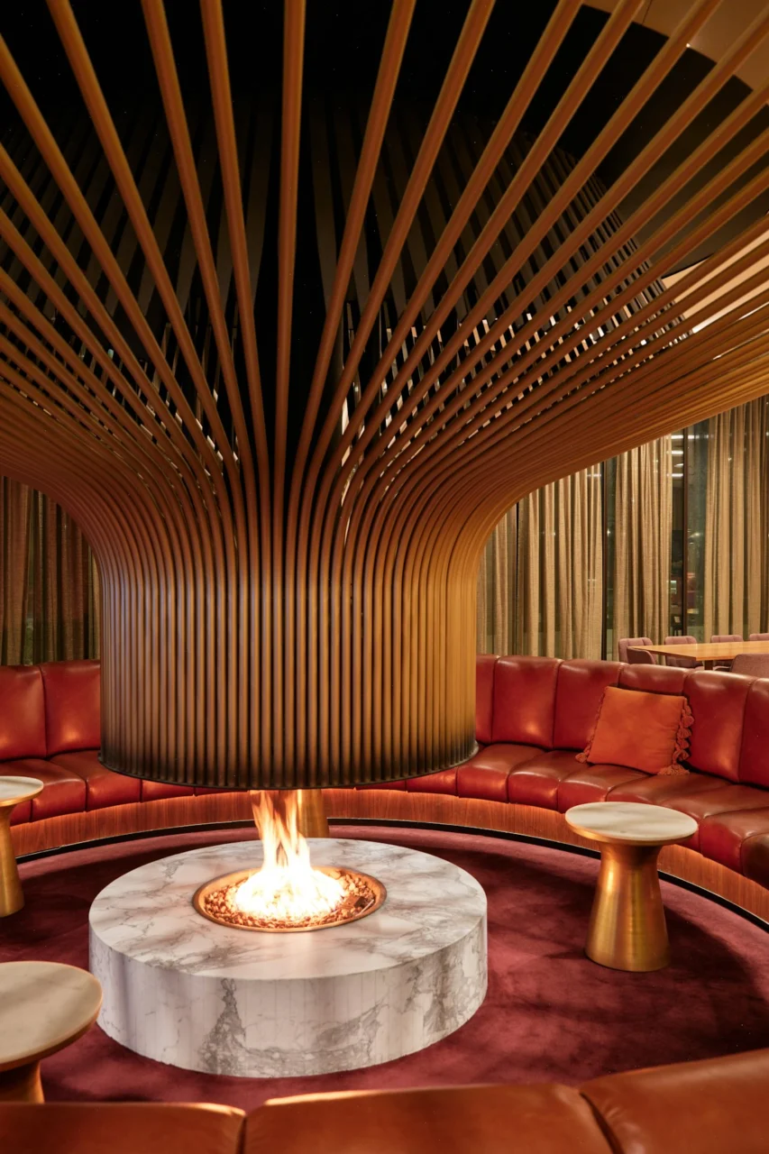 Circular lounge with modern fireplace and wood ceiling