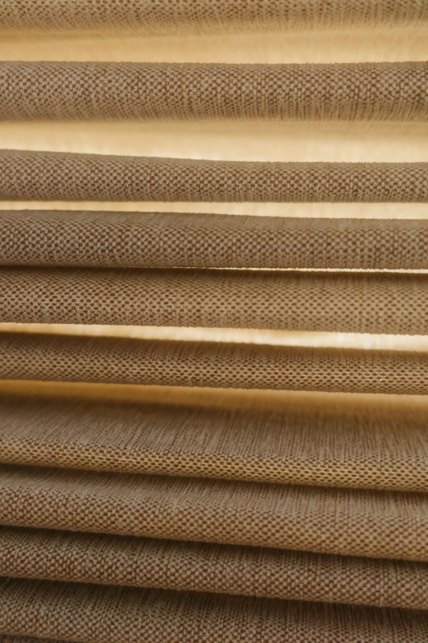 Close-up of horizontal blinds with textured fabric