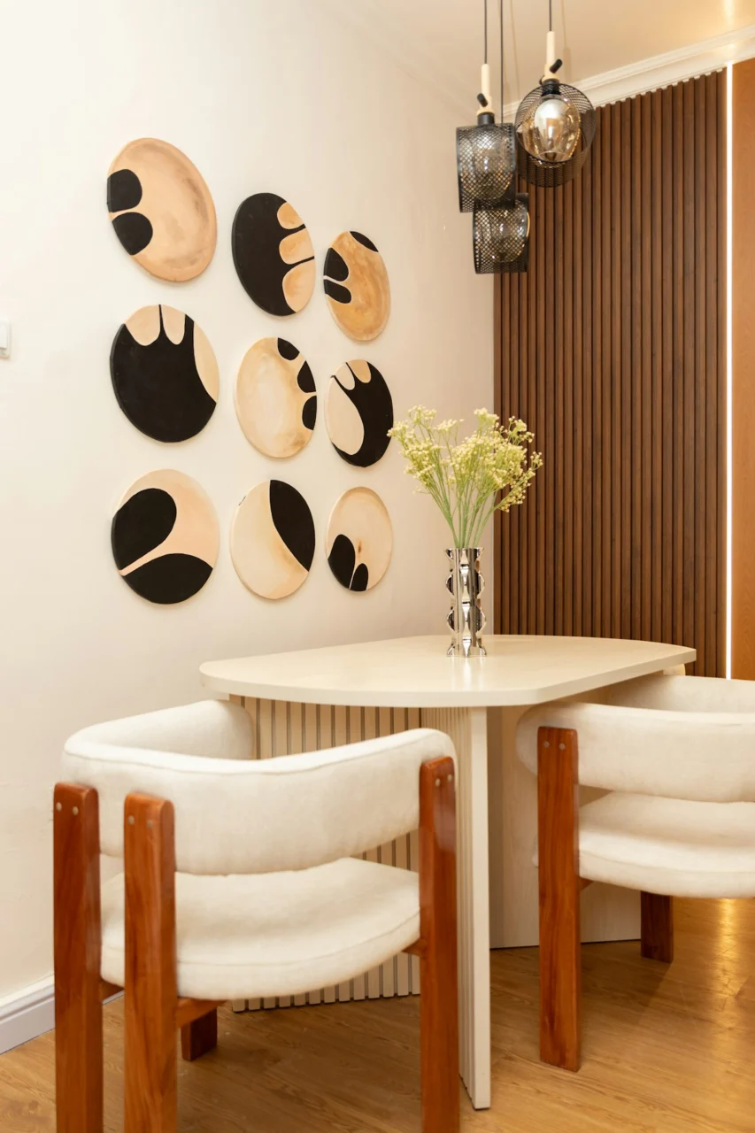 Elegant dining space with abstract wall decor and modern furniture