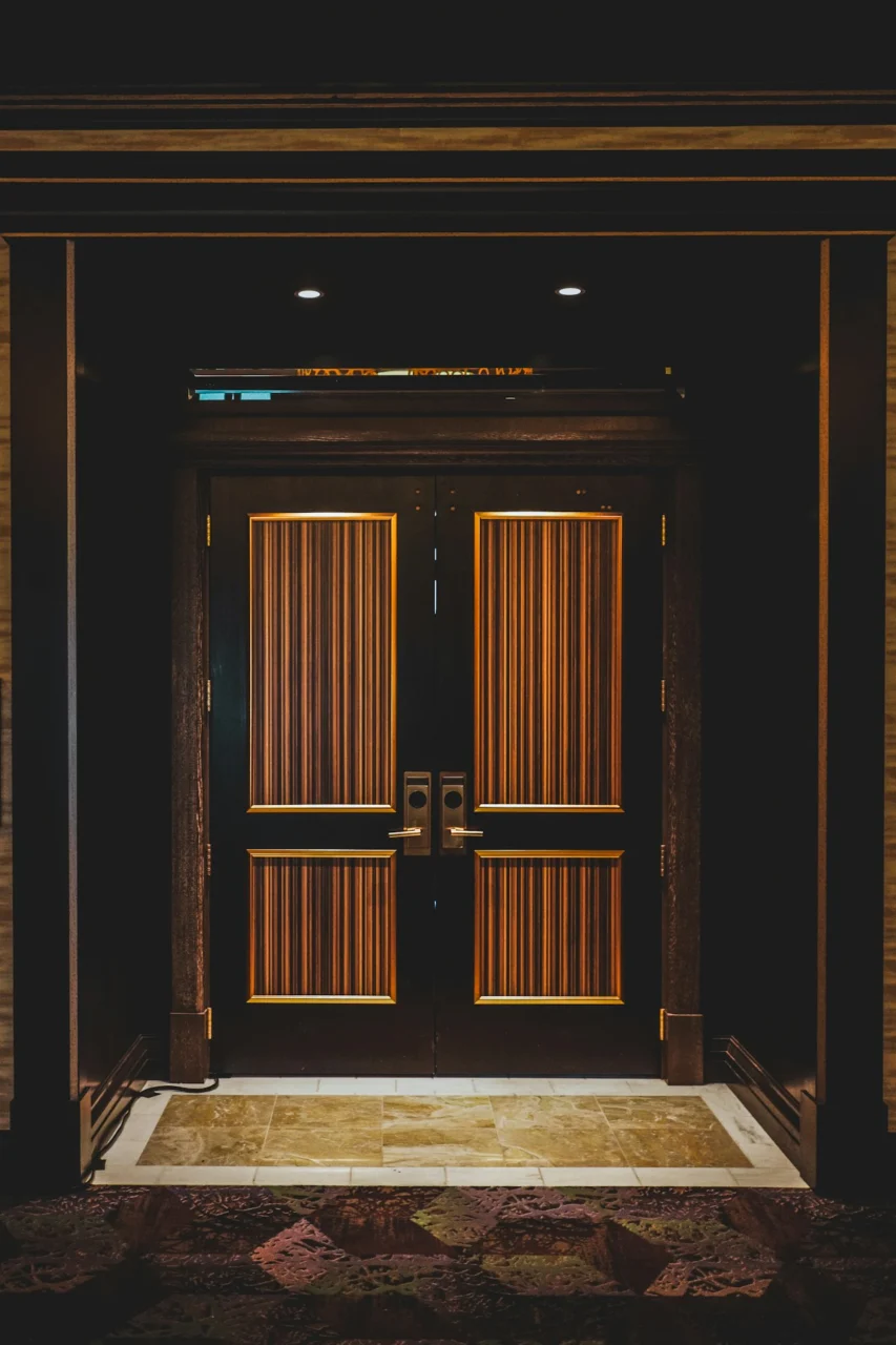 Elegant double doors with ornate gold trim