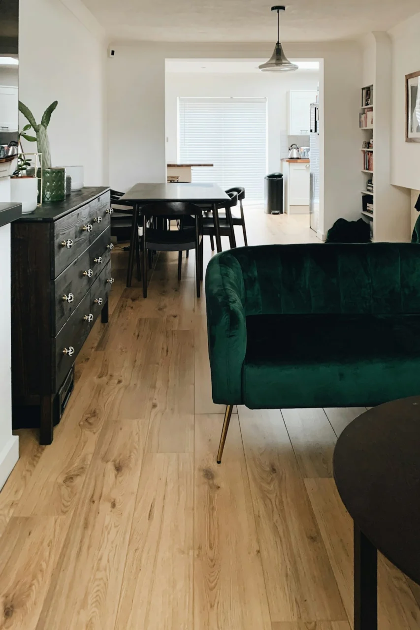 green sofa beside black wooden table