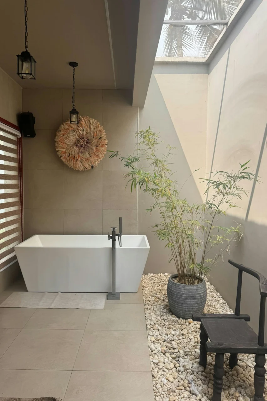 Modern bathroom with bathtub and bamboo plant
