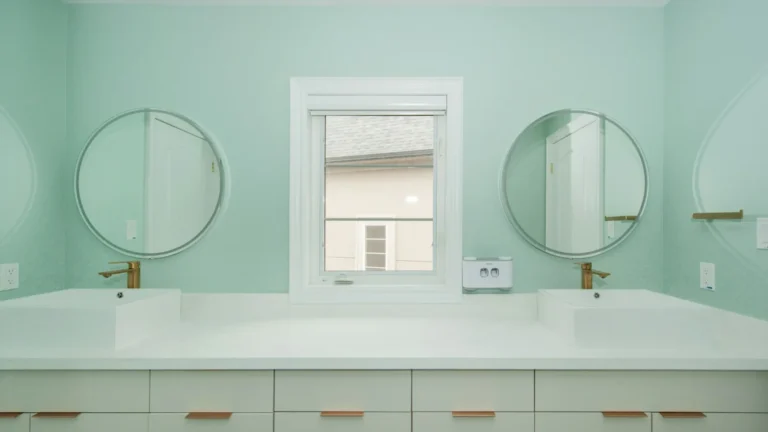 Modern bathroom with double vanity and mint green walls