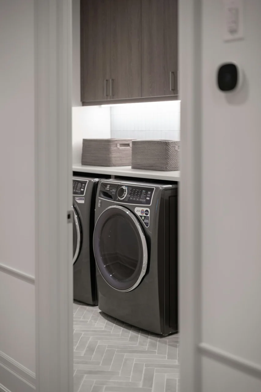 Modern laundry room with gray washer and dryer