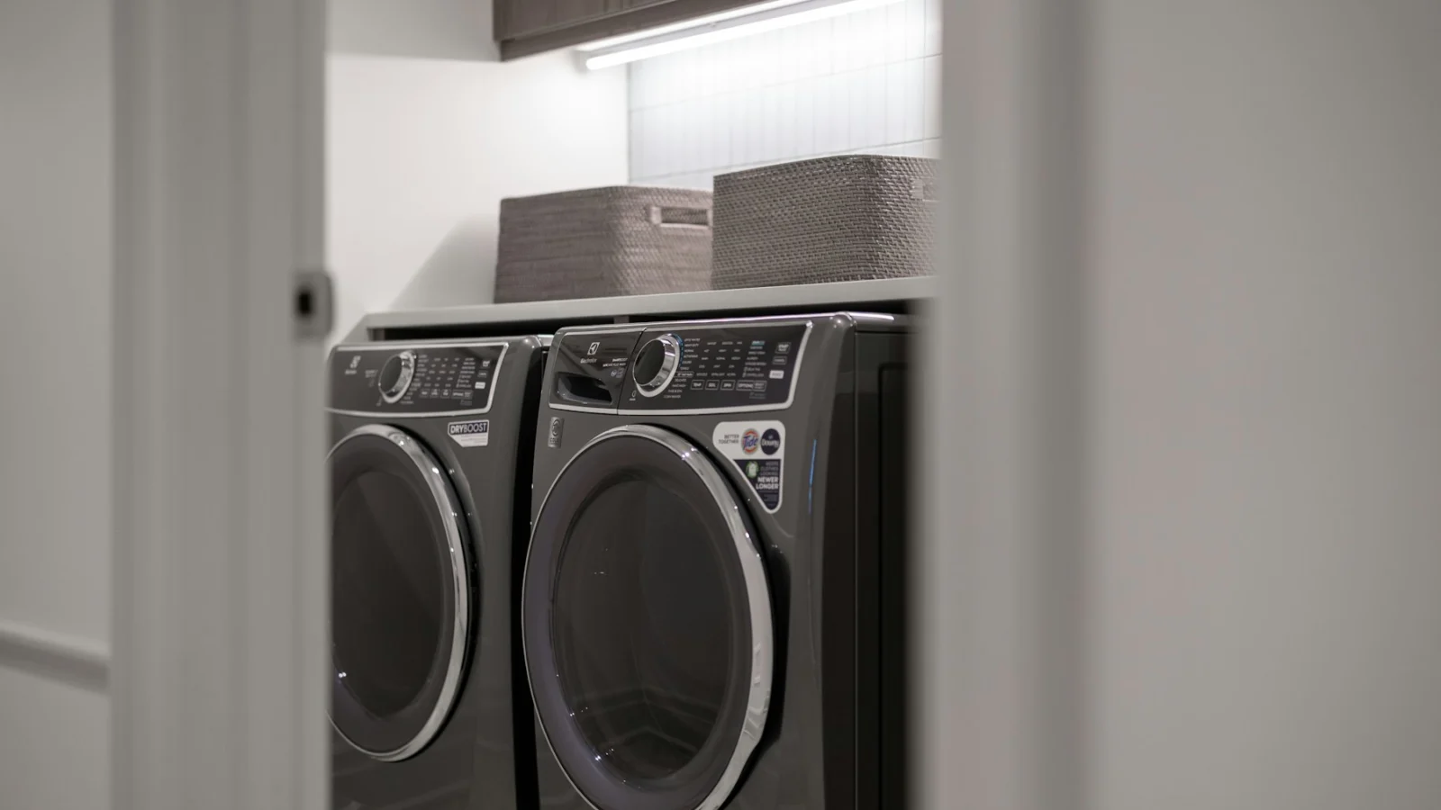 Modern laundry room with matching washer and dryer