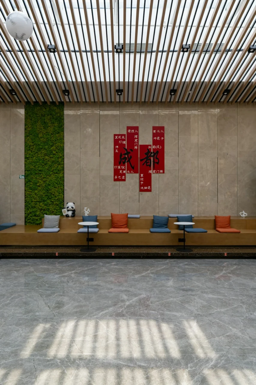 Modern lounge area with wooden benches and cushions