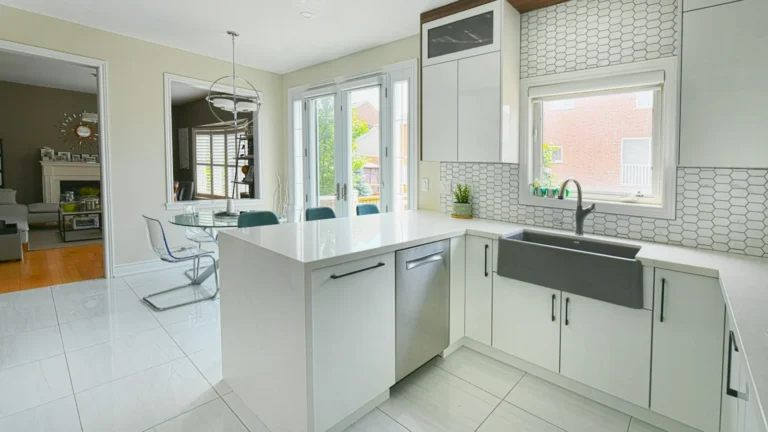 Modern white kitchen with island and dining area