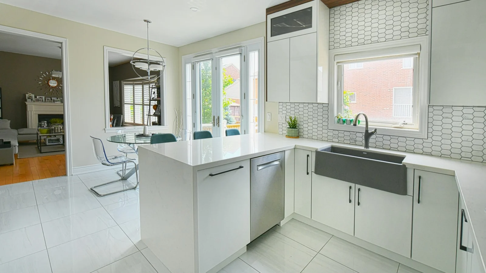 Modern white kitchen with island and dining area