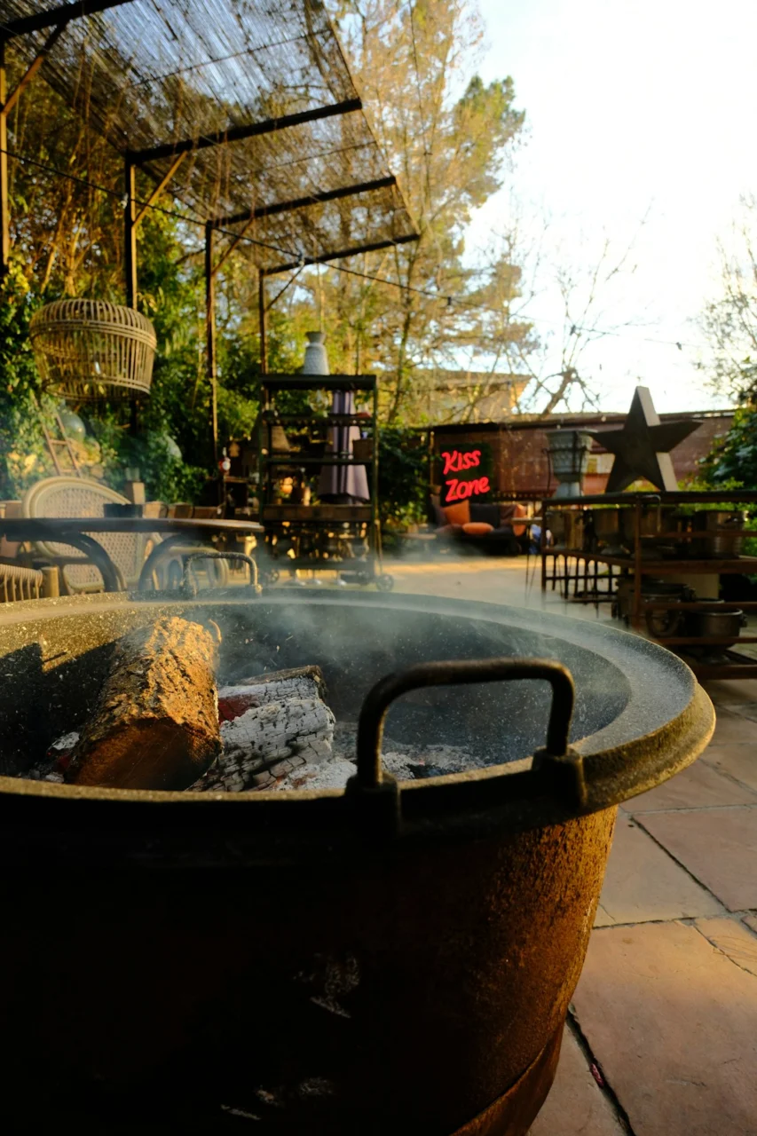 Outdoor fire pit with logs and smoke