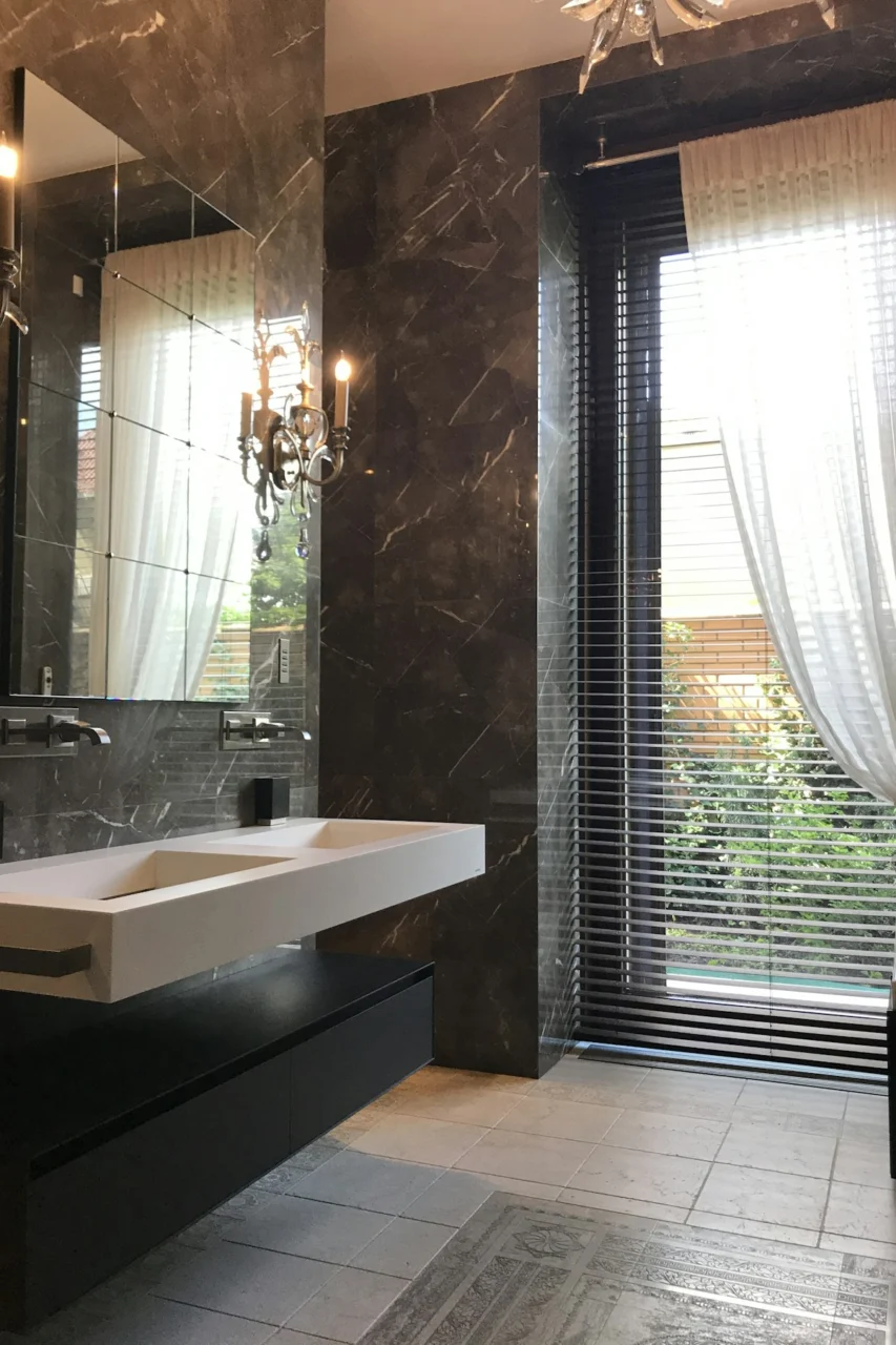 two white ceramic sink and gray stainless steel fauctes