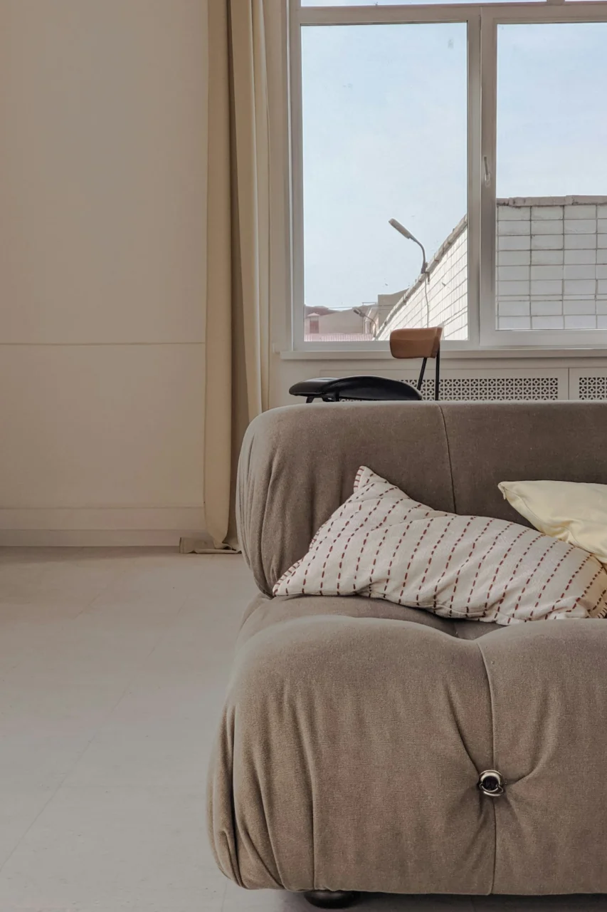 white and black pillow on bed