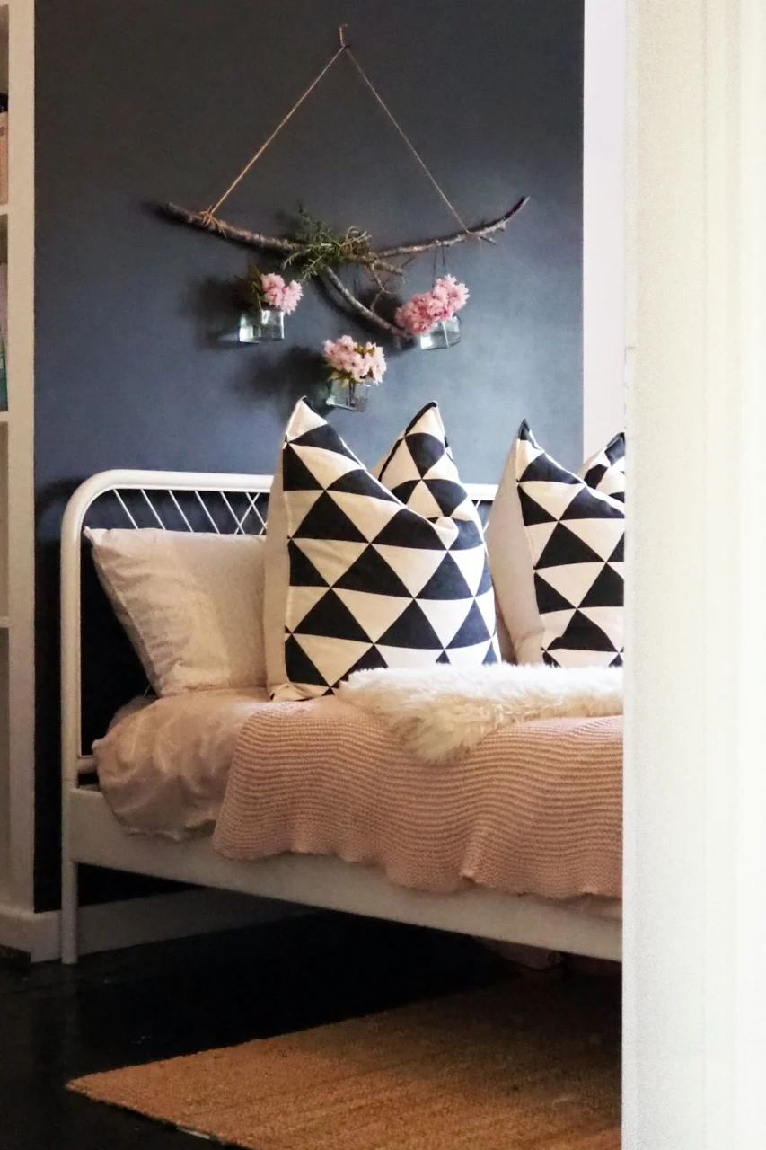 white and black throw pillows on white couch