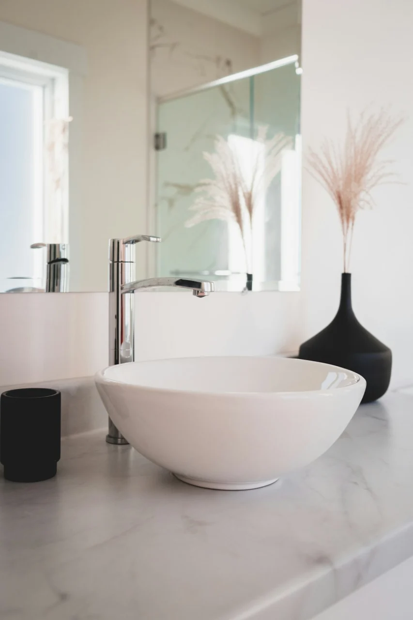 white ceramic bowl on black table