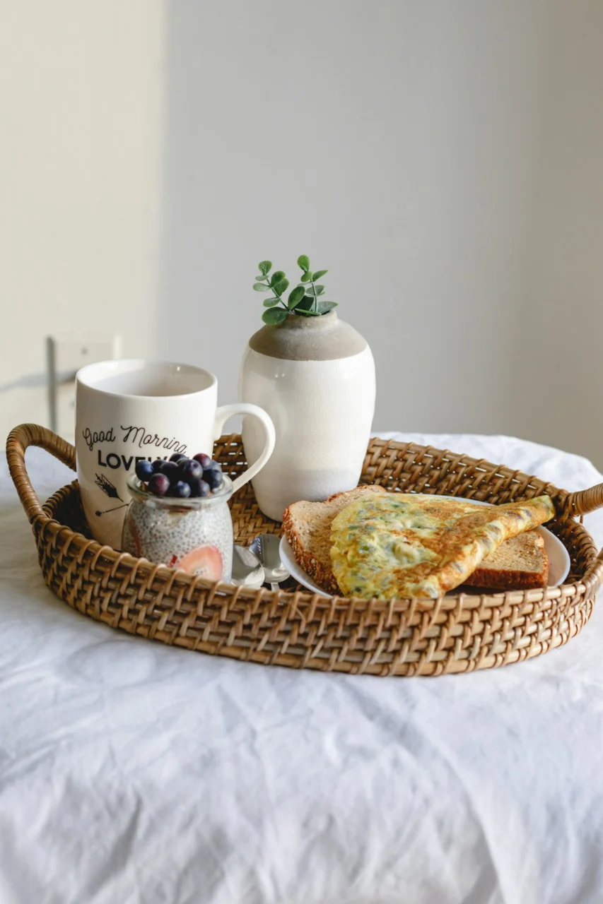 white ceramic mug on brown woven tray