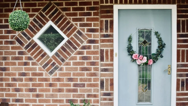 white wooden window with red flowers